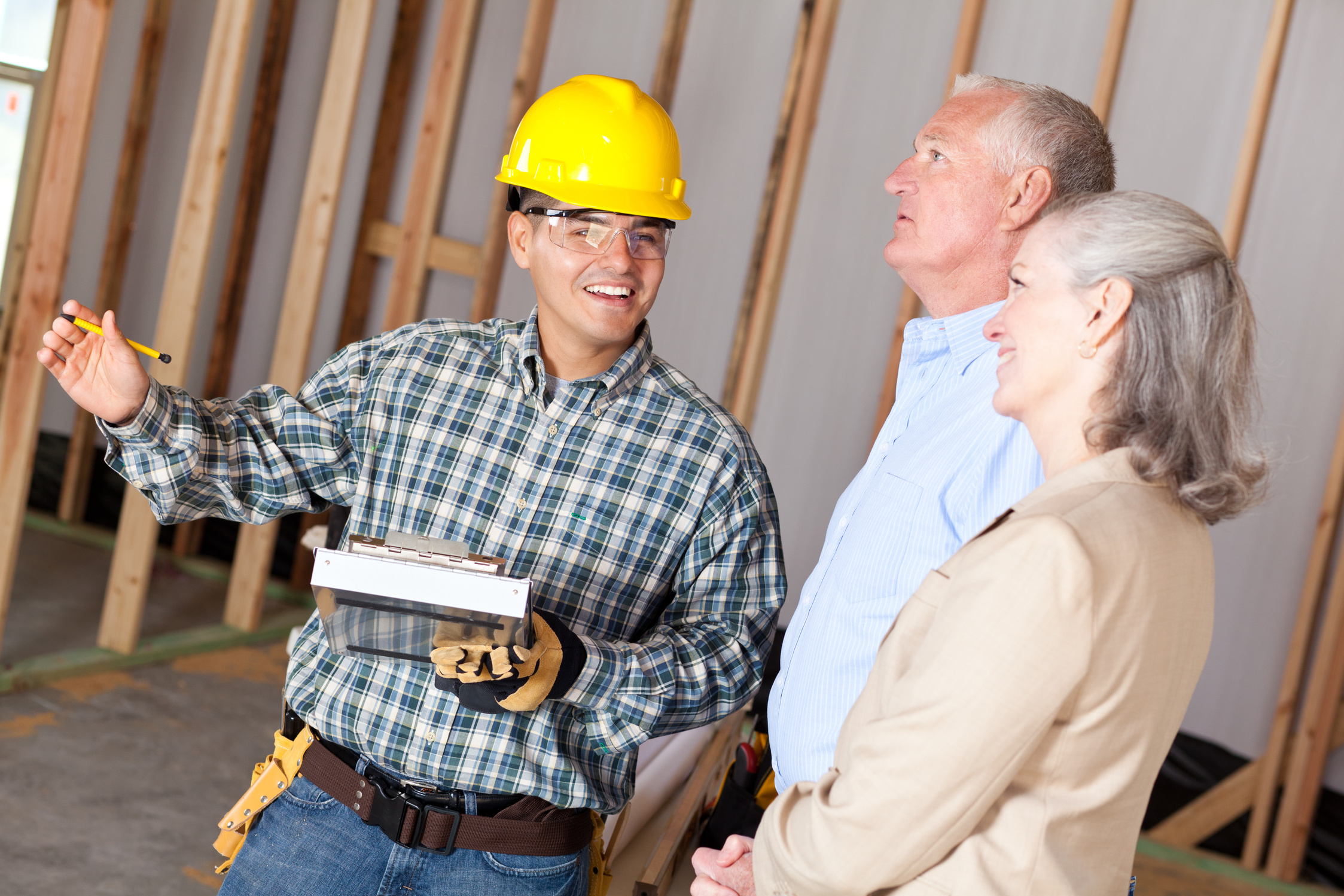 Construction foreman explaining layout to customers